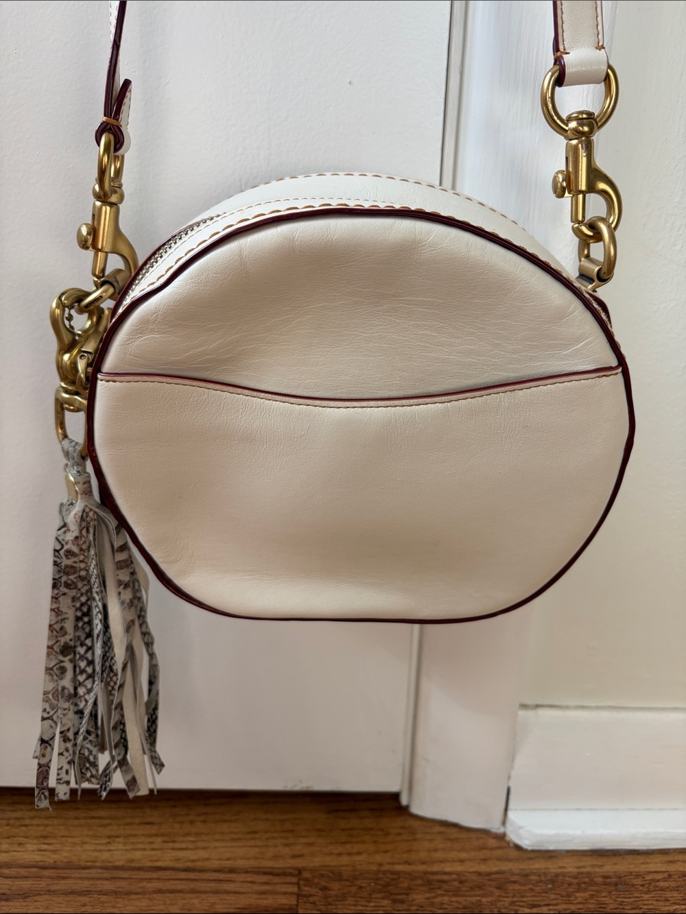COACH Cream Round Crossbody Bag with Tassel